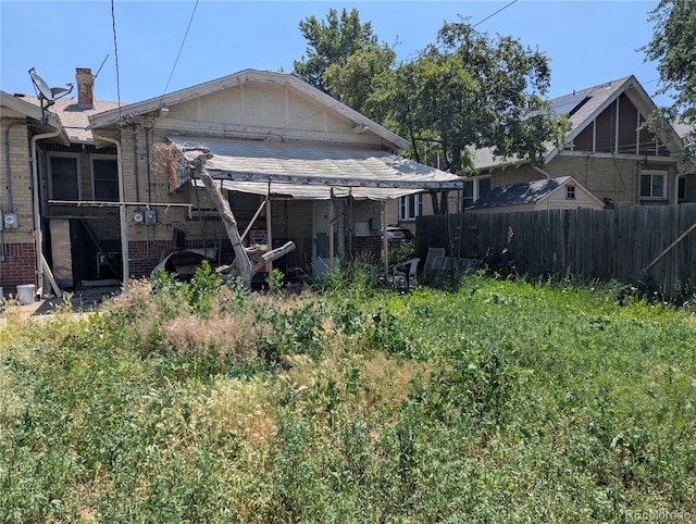 1415 Raleigh St, Denver, CO 80204 - rear view of property with brick siding and a chimney