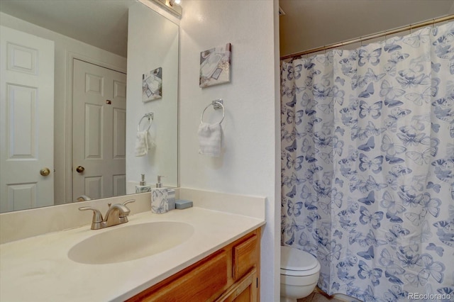 11115 E Alameda Ave Unit 201, Aurora, CO 80012 - bathroom with vanity, toilet, and a shower with curtain