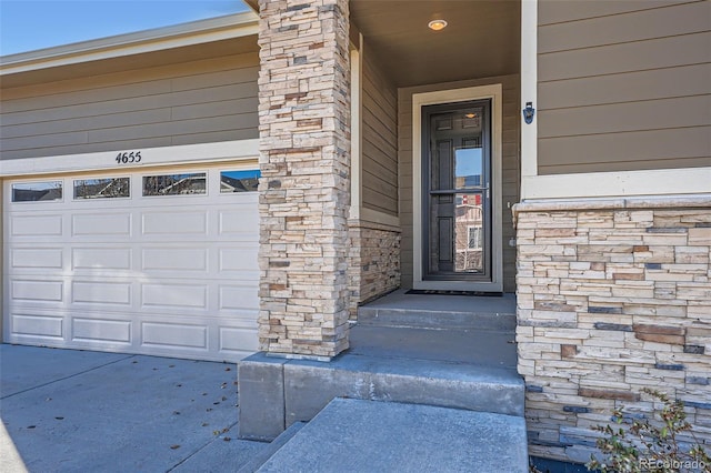 entrance to property featuring a garage