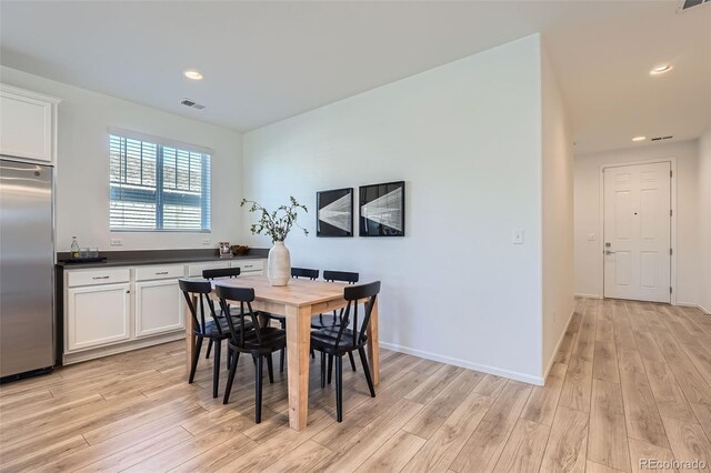 dining space featuring light hardwood / wood-style flooring