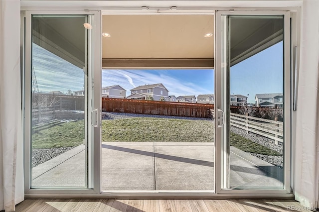 doorway to outside with hardwood / wood-style floors