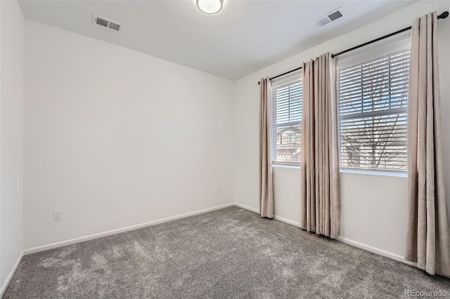 unfurnished room featuring carpet floors