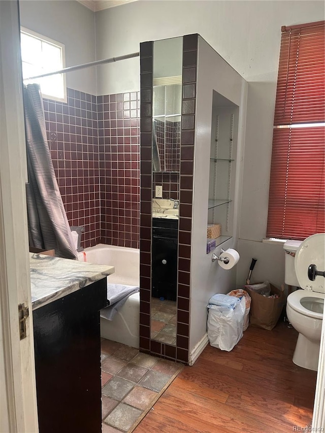36 N Logan St, Denver, CO 80203 - full bath featuring vanity, toilet, shower / bath combo, and wood finished floors