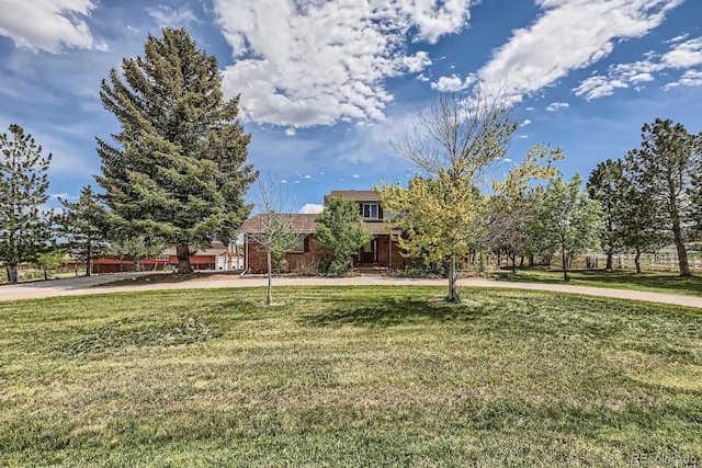 6646 S Fundy Ct, Centennial, CO 80016 - view of property hidden behind natural elements with a front yard and brick siding
