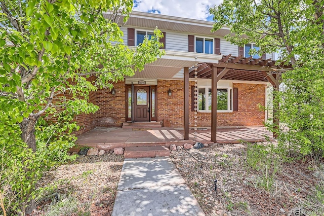 6646 S Fundy Ct, Centennial, CO 80016 - traditional-style house with brick siding, a pergola, and covered porch