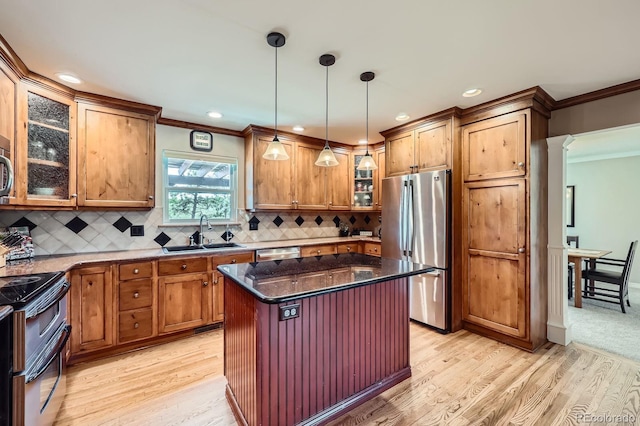 6646 S Fundy Ct, Centennial, CO 80016 - kitchen with stainless steel appliances, a sink, crown molding, light wood-style flooring, and glass insert cabinets