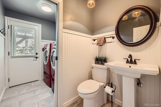 6646 S Fundy Ct, Centennial, CO 80016 - bathroom with toilet, wainscoting, and a decorative wall