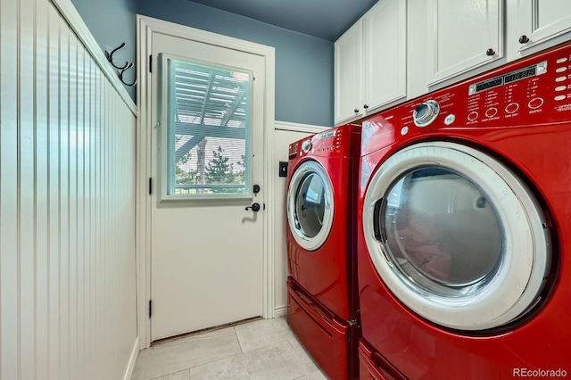 6646 S Fundy Ct, Centennial, CO 80016 - laundry room with cabinet space, separate washer and dryer, light tile patterned floors, and baseboards