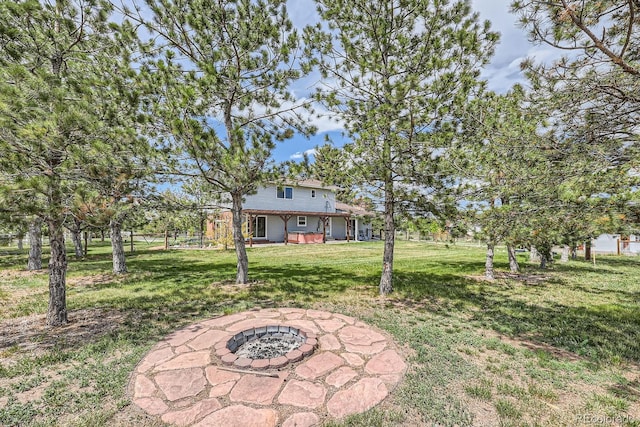 6646 S Fundy Ct, Centennial, CO 80016 - view of green lawn with an outdoor fire pit