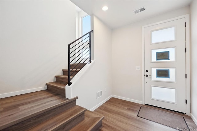 foyer with light hardwood / wood-style floors