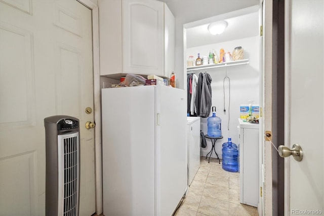 washroom with washing machine and clothes dryer and light tile patterned floors