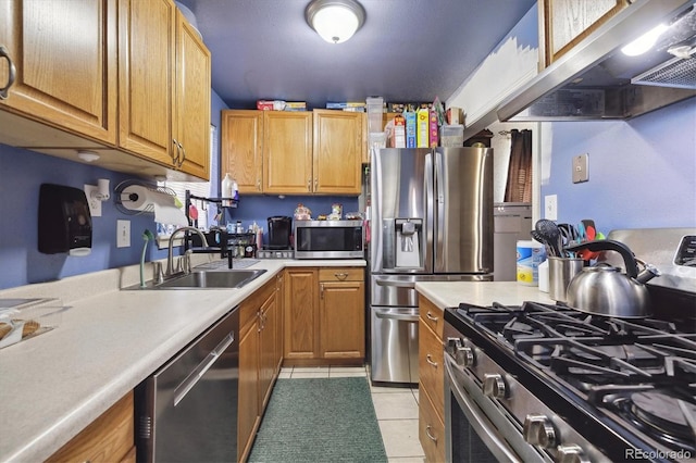 kitchen with light tile patterned flooring, sink, appliances with stainless steel finishes, and ventilation hood