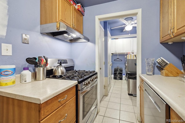 kitchen with ceiling fan, light tile patterned flooring, and appliances with stainless steel finishes