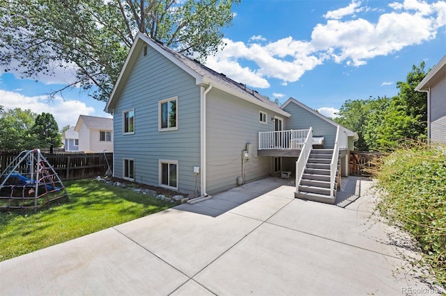 4786 S Yampa St, Aurora, CO 80015 - rear view of house featuring a patio area, a fenced backyard, stairway, and a deck
