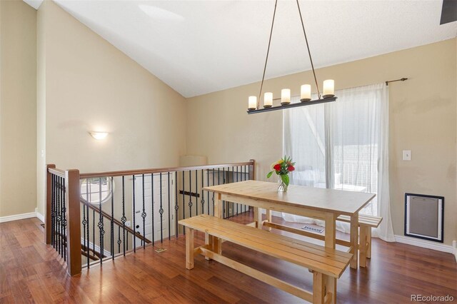 4786 S Yampa St, Aurora, CO 80015 - dining area with wood finished floors and lofted ceiling