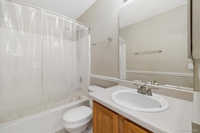 full bathroom featuring vanity, toilet, and shower / bath combo with shower curtain