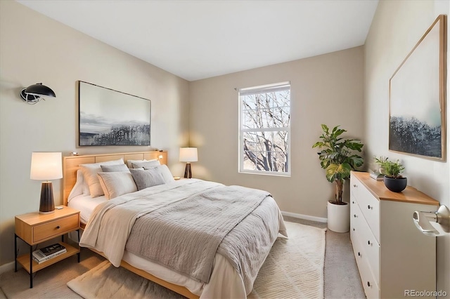 bedroom with light colored carpet