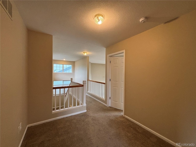 10027 Sylvestor Rd, Highlands Ranch, CO 80129 - corridor with an upstairs landing, carpet, and a textured ceiling