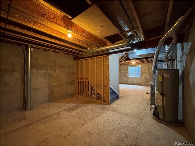 10027 Sylvestor Rd, Highlands Ranch, CO 80129 - below grade area featuring gas water heater and stairs