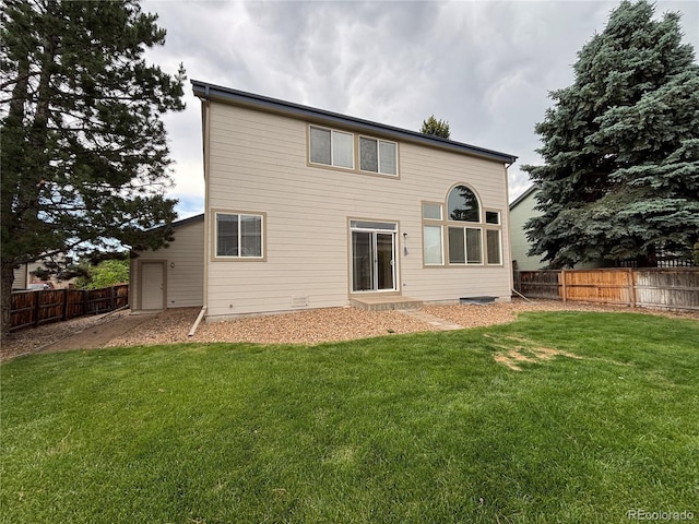 10027 Sylvestor Rd, Highlands Ranch, CO 80129 - rear view of house with a fenced backyard