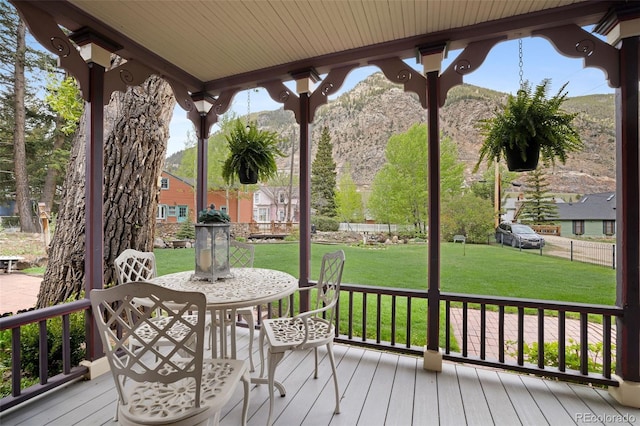 715 Main St, Georgetown, CO 80444 - deck featuring a mountain view and a lawn