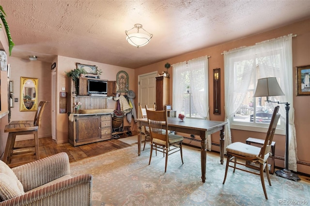 715 Main St, Georgetown, CO 80444 - dining space featuring light wood-style flooring and a textured ceiling