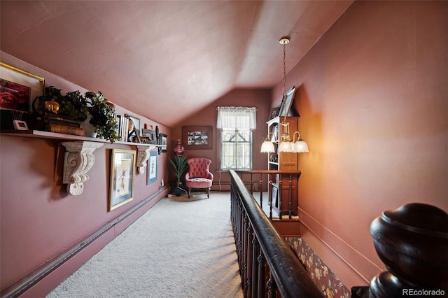 715 Main St, Georgetown, CO 80444 - hallway featuring vaulted ceiling, carpet flooring, and an upstairs landing