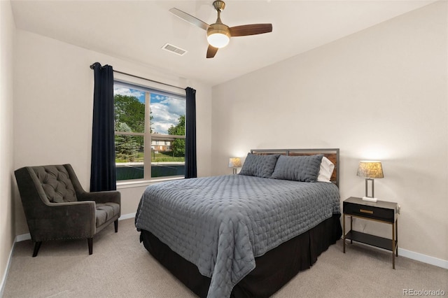 bedroom with light colored carpet and ceiling fan