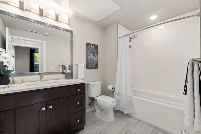 full bathroom with shower / tub combo, vanity, and toilet