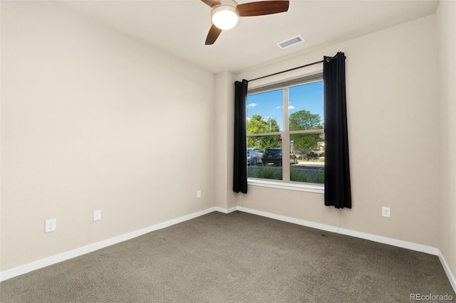 empty room with carpet flooring and ceiling fan