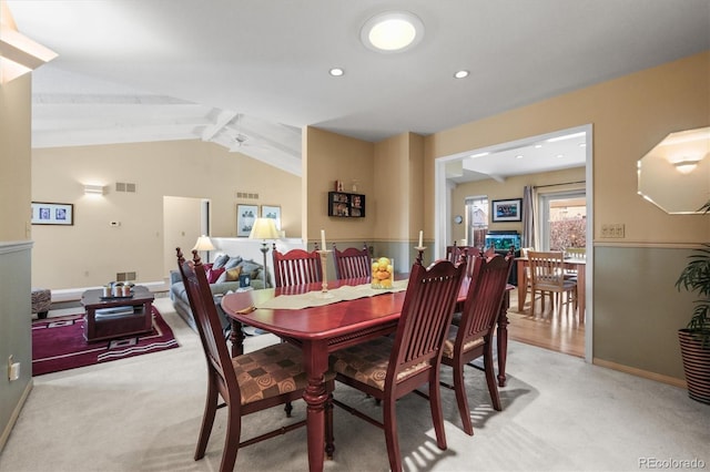 dining space featuring light carpet, recessed lighting, visible vents, and vaulted ceiling with beams