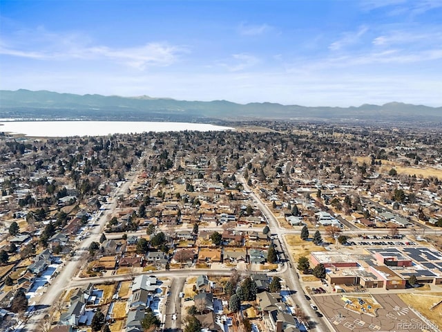 birds eye view of property with a residential view and a water and mountain view