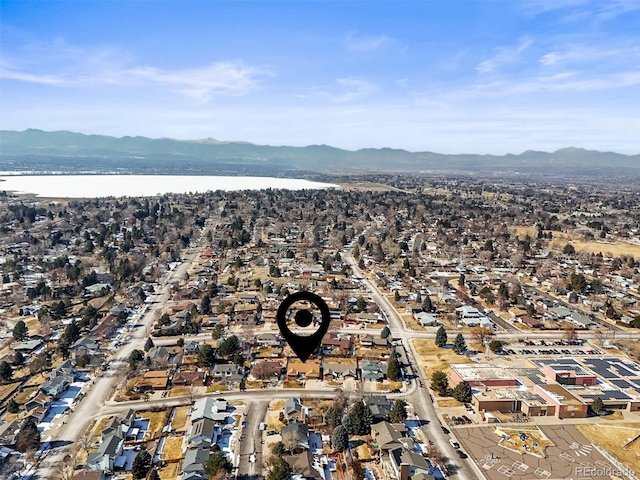 4621 S Perry Way, Denver, CO 80236 - aerial overview of property's location featuring a water and mountain view and nearby suburban area
