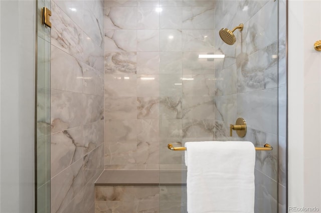 bathroom with a tile shower