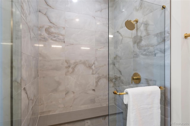 bathroom with a tile shower