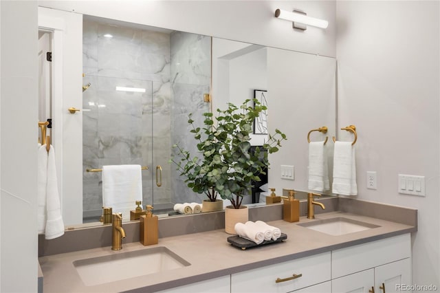 bathroom with vanity and a shower with shower door