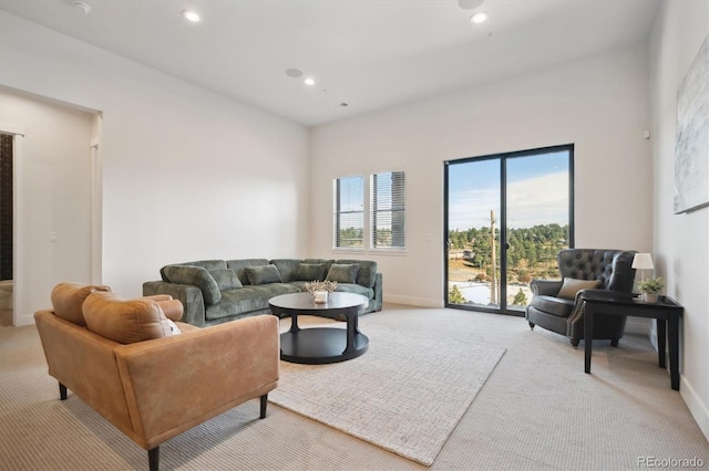 living room featuring light carpet