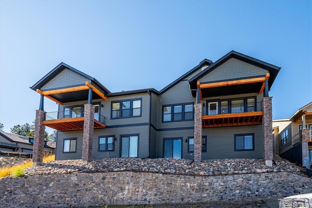 view of front of property with a balcony