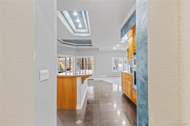 corridor with ornamental molding, a baseboard radiator, granite finish floor, and recessed lighting