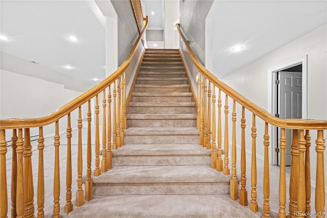 stairway featuring recessed lighting