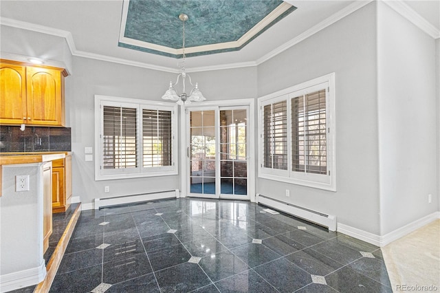 unfurnished dining area featuring granite finish floor, a baseboard radiator, baseboards, and ornamental molding