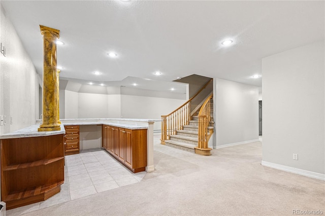 bar featuring recessed lighting, ornate columns, light colored carpet, built in study area, and baseboards