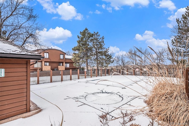 view of yard layered in snow