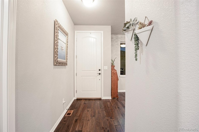 hallway featuring dark wood-type flooring