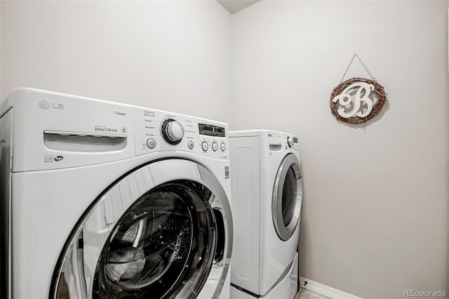 laundry room featuring washing machine and dryer