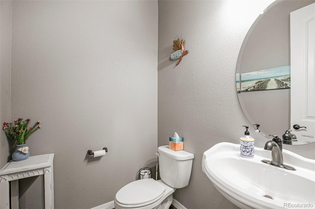 bathroom with sink and toilet