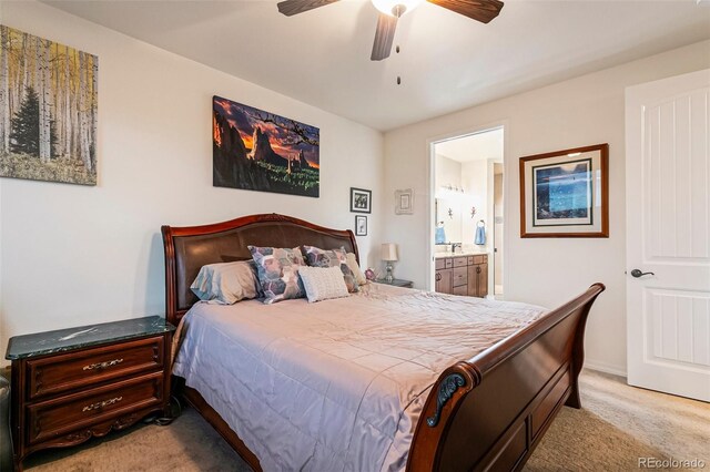 bedroom with light carpet, ensuite bathroom, and ceiling fan