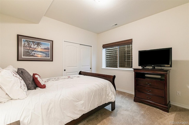 carpeted bedroom featuring a closet