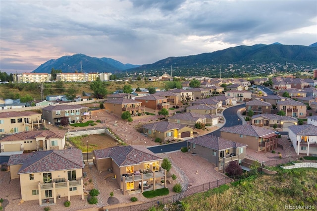 birds eye view of property featuring a mountain view