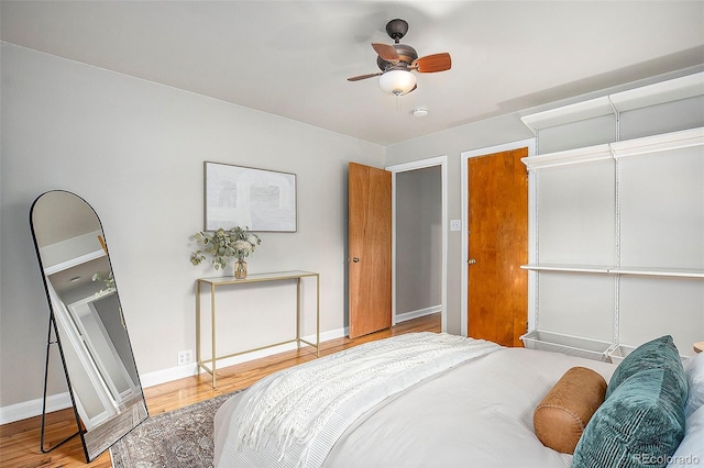 bedroom with ceiling fan and hardwood / wood-style floors